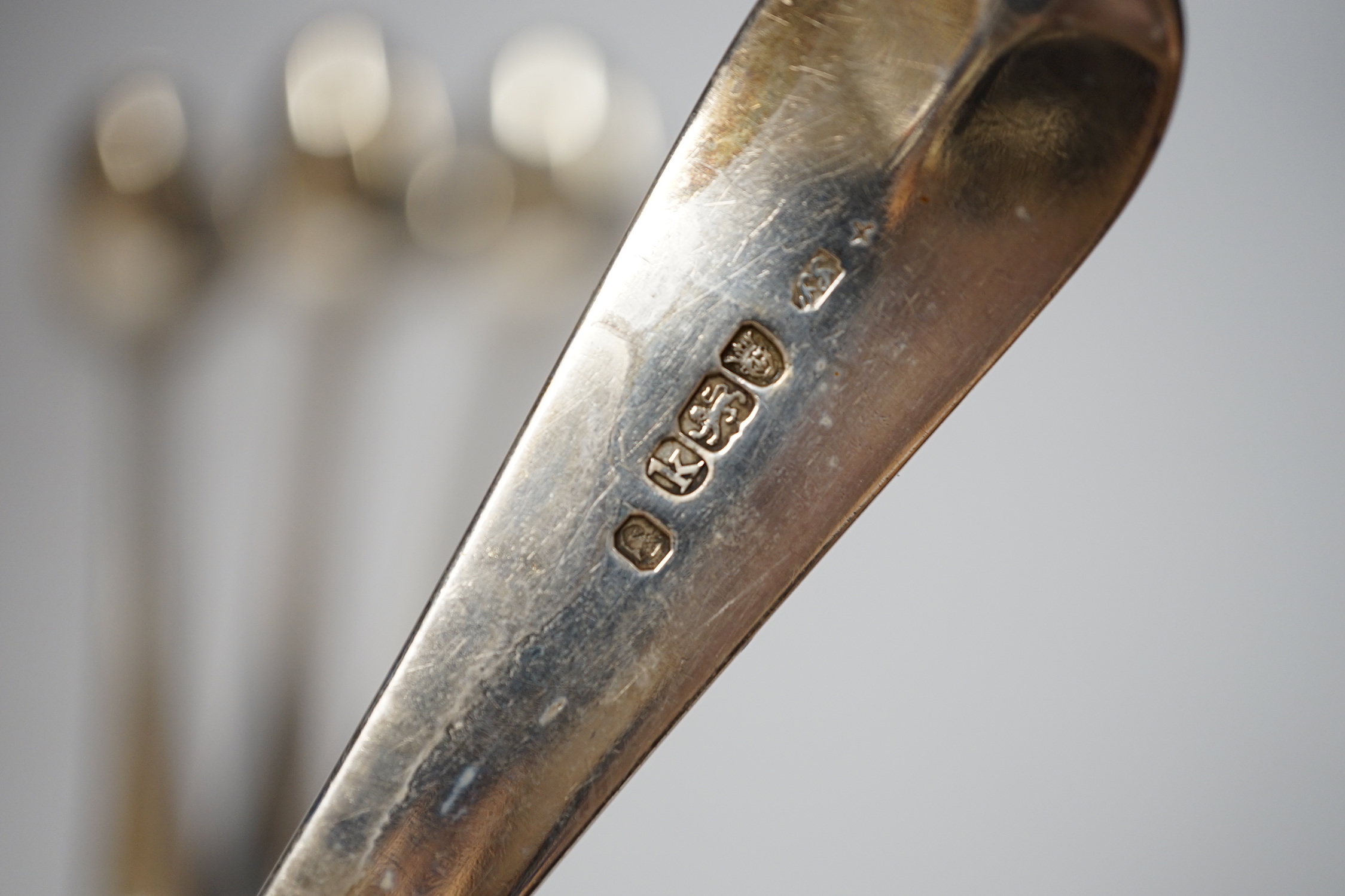 A pair of George III silver beaded Old English pattern basting spoons, George Smith III, London, 1785, 29.5cm and a later silver Old English pattern pair by Peter & William Bateman, 15oz.
